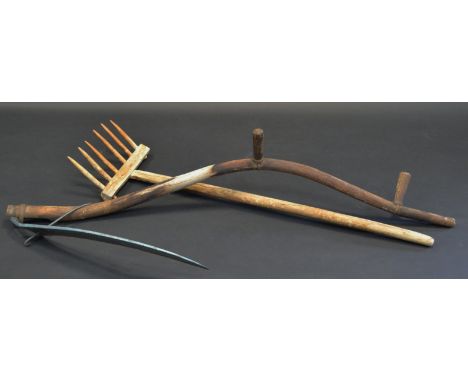 A rustic scythe; a late Victorian wooden pitch fork (2)