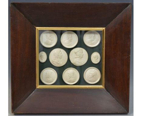 An arrangement of plaster intaglios, mostly profile portrait medallions, 13cm x 15cm, mahogany  frame