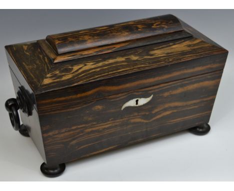 An early Victorian rosewood domed sarcophagus shaped tea caddy, mother of pearl escutcheon,pierced ebony swing hoop handles, 
