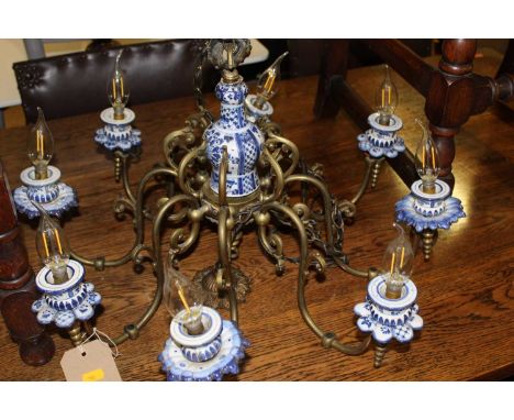 A Dutch brass and blue &amp; white underglaze ceramic mounted eight light hanging electrolier, approx drop 40cm