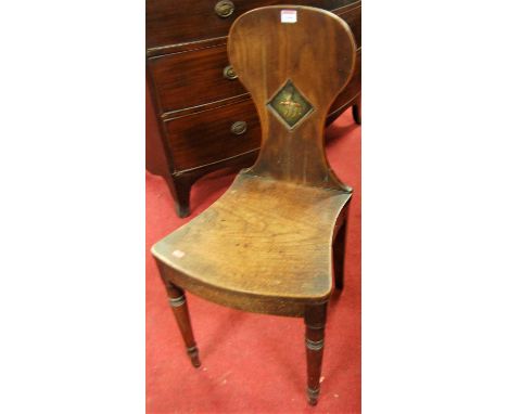 A Regency mahogany panelled seat single hall chair, the lozenge detail back with polychrome painted decoration, raised on rin
