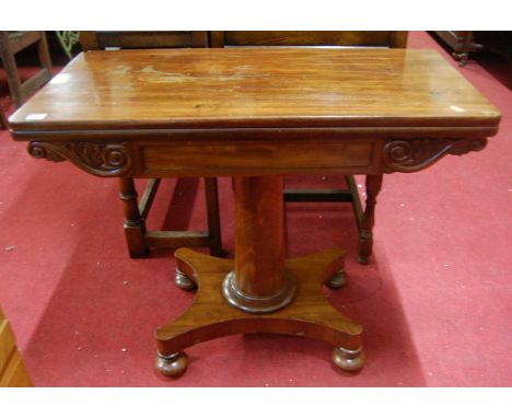 An early Victorian mahogany round cornered fold-over card table, having a plain turned column to quatroform base, width 91cm