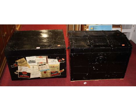 A black painted wooden trunk, decorated with champagne labels; and one other (2)
