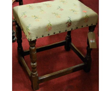 A contemporary joined oak and tapestry studded upholstered dressing stool, width 46.5cm