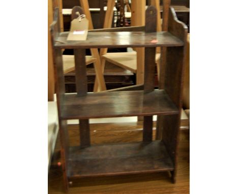 A small 1930s oak three-tier wall shelf, w.37cm; together with a two-fold towel rail (2)
