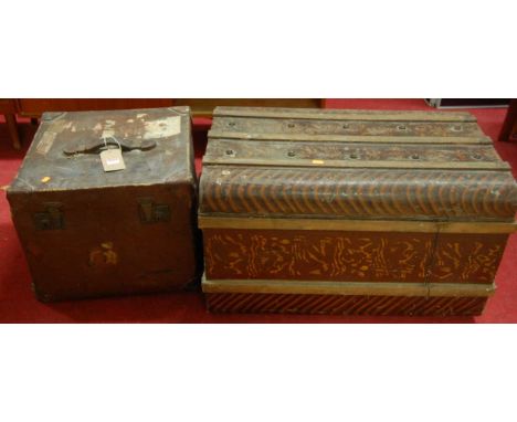 An early 20th century stained metal hinge top trunk, together with a further canvas square trunk (2)