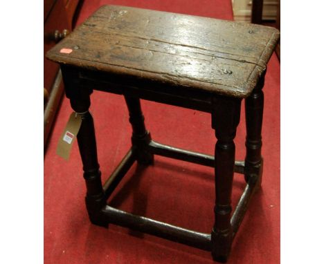 An antique joined oak joint stool raised on ring turned square cut supports, united by lower stretchers, width 45cmCondition 