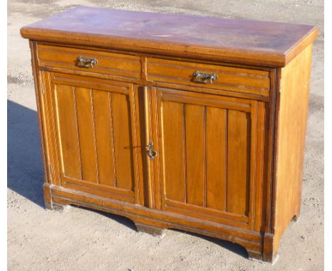 EDWARDIAN WALNUT CABINET WITH TWO DRAWERS AND TWO PANELLED DOORS, ON BRACKET FEET, LABELLED S & H JEWELL 29, 30 & 31 LITTLE Q