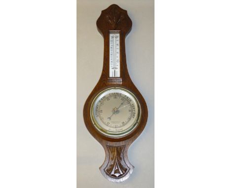 GEORGE V BAROMETER WITH A CIRCULAR DIAL INSCRIBED 'WINEGARTENS LTD, LONDON EC2' ENCLOSING AN ANEROID MOVEMENT, WITH THERMOMET