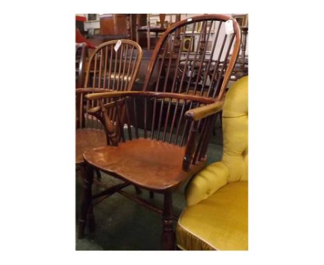 19th century elm hard seated high stick back Windsor armchair, with turned front legs supported by an H-stretcher  