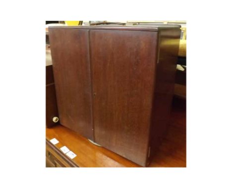 Mahogany framed table top two door record cabinet, with pierced floral grilled speaker and assorted combs to back (A/F)