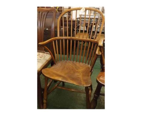 19th century elm shaped hard seated stick back Windsor chair, supported by four  turned legs and an H-stretcher (feet tipped)