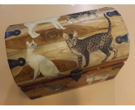 Small Eastern hardwood dome top storage trunk with side handles and scrapwork cut outs of cats to lid together with a quantit