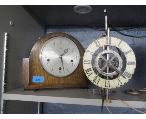 Two clocks to include an early 20th century Smith oak cased mantel clock 