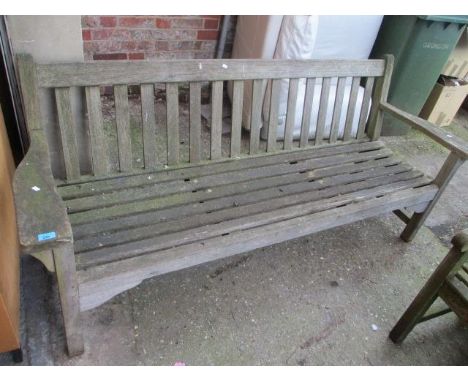 A large teak garden bench 32"h x 76 3/4"w 