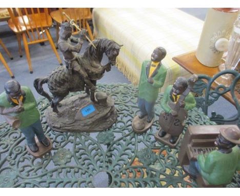 A painted plaster band and a model of a knight on horseback 