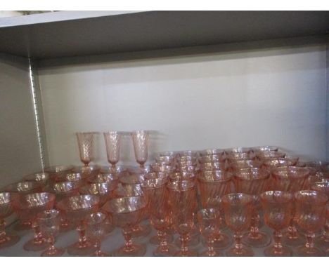 A quantity of pink drinking glasses to include twelve wine, twelve champagne flutes, sixteen champagne saucers and eighteen s