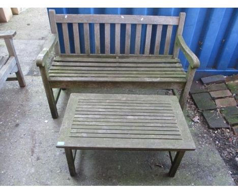 A teak garden bench 33"h x 48"w, together with a teak coffee table 15 1/4"h x 32 1/4"w 