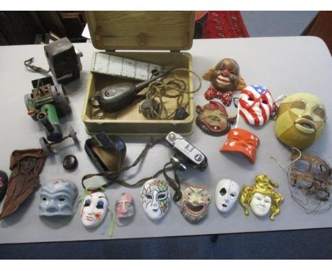 A mixed lot to include a vintage oil can, a cine camera, a Rival 35mm camera, a Mamod traction engine and various masks 