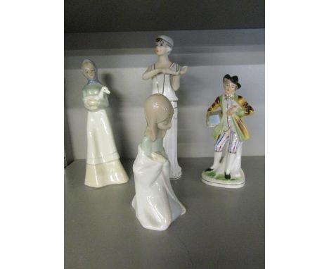 A group of four porcelain figurines to include a Lladro model of a kneeling girl 
