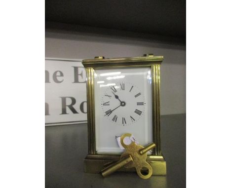 A Mappin &amp; Webb brass five window carriage clock with key 