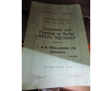 A group of woodworking tools to include three Stanley planes, a metal square and other items 