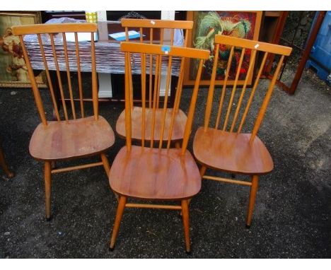 A set of four mid 20th century Ercol stick back dining chairs 