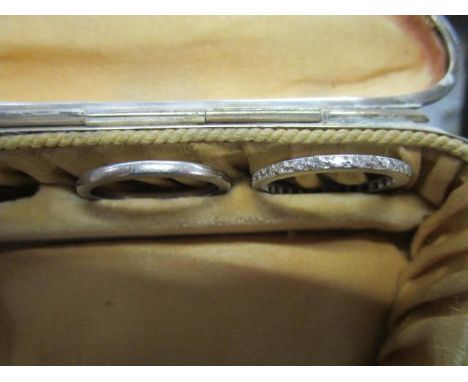 A white metal diamond full eternity ring, along with a white metal (possibly platinum) wedding band, total weight 4.9g 