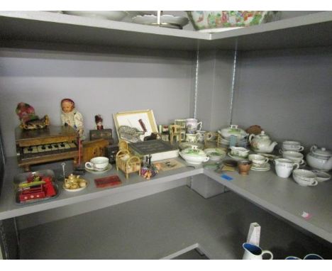 A mixed lot of dolls house furniture, dolls, and childrens' porcelain tea sets to include The Pit A Pat Piano Co London woode