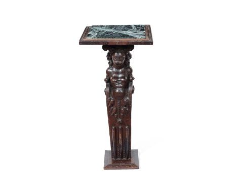 A large 17th century carved oak caryatid figure, converted to a console tableWith later verde antico rectangular marble top, 