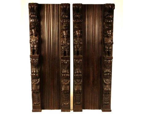 A pair of 19th-century carved oak architectural panelsEach with a pair of uprights formed of musicians with scrollwork and fr