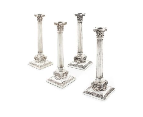 A good set of four Victorian silver plated Corinthian column candlesticks, one only with mark of Martin, Hall & Co., the rema