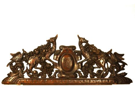 Two large architectural fragments, 19th centuryComprising: a large 19th century French carved walnut overdoor with central ca