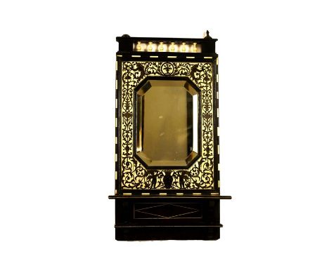 A 19th century Italian carved walnut fragment/frame and two mirrorsThe frame with circular aperture within a leaf moulded bor