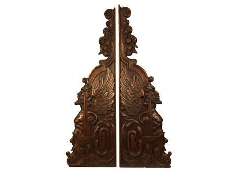 A group of 19th-century architectural fragments and crestingsComprising: a section of a carved walnut overdoor with griffins 