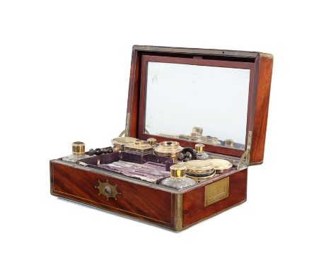 A 19th century French mahogany and brass bound gentleman's travelling box (nécessaire de voyage) with silver-gilt fittings by