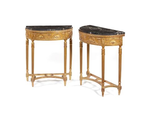 A pair of late 19th century neo-classical carved gilt wood and composition console tablesIn the manner of Robert Adam, the de