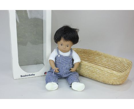 A Sasha 'Baby Doll', with brown hair and brown eyes, no. 510, in striped denim playsuit, makers tag to wrist, 30cm, with mose