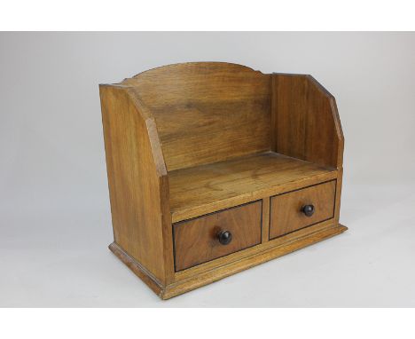 A walnut book trough with two drawers and plinth base, 39cm