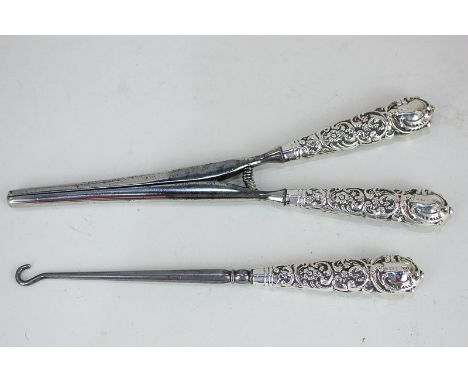 A pair of Edward VII silver mounted glove stretchers and matching button hook, maker Arthur Willmore Pennington, Birmingham 1