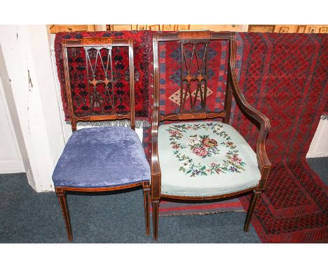 An Edwardian inlaid mahogany carver chair with diamond pierced back splat over tapestry upholstered seat, on tapered front le