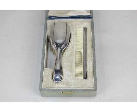 A French 800 silver mounted cased christening set of hair brush and comb