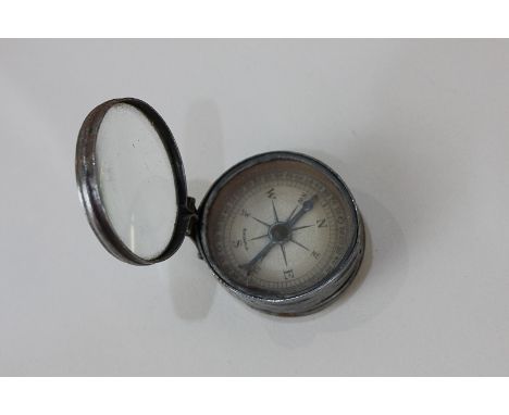 A 20th century compass with mirror back, marked Bavaria, 4cm diameter