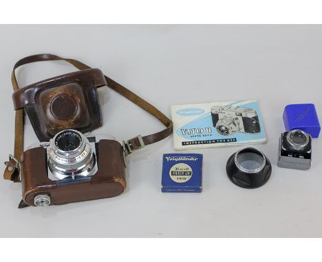 A Voighander Vito B camera in leather case embossed 'West Germany', with leaflet, filter and other accessories