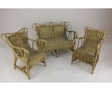 A set of miniature cane doll's furniture comprising sofa and two chairs