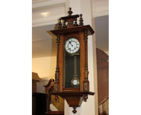 A Vienna style wall clock with circular white enamel dial, with brass pendulum, in glazed panel case, 88cm