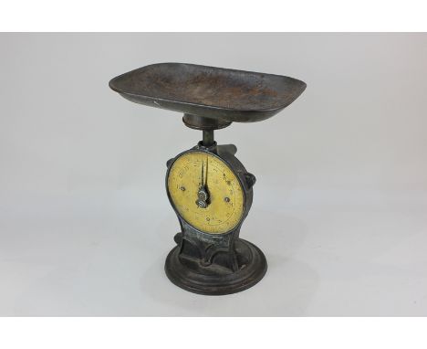 A set of Salters cast iron scales with circular brass dial inscribed 'Salters Improved Family Scale, No 50', 31cm high
