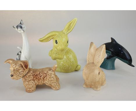 Two Sylvac pottery ornaments of rabbits (one a/f), a Poole Pottery dolphin, and two other animal ornaments