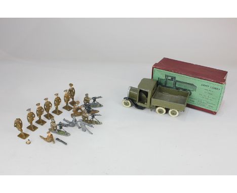 A Britains die cast metal army lorry with driver, No 1335, boxed, together with a small collection of metal toy soldiers (all