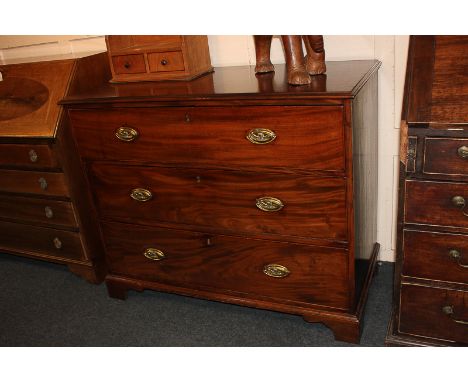 A mahogany chest of three graduated drawers with brass drop handles with fox embossed back plates, on bracket feet, 110cm